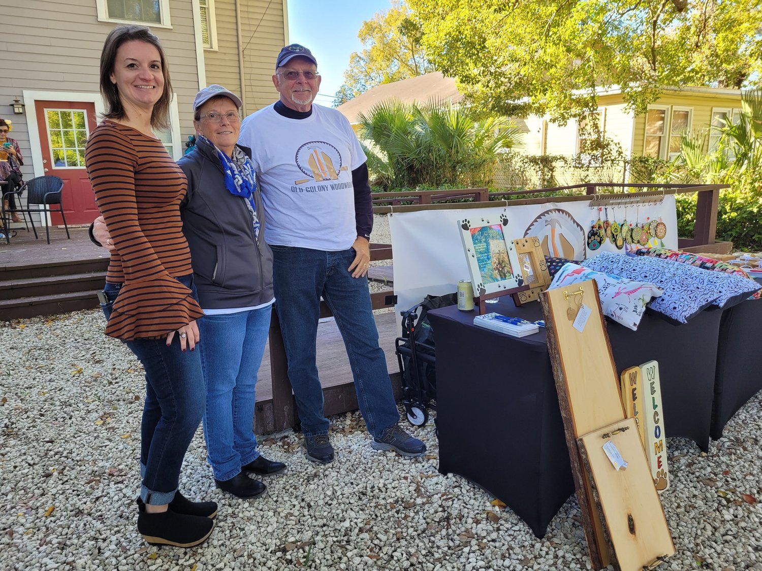 Dr. Carla Rodrigues, left, and Old Colony Woodwork vendors at the Artisans Market fundraiser for Celestial Farms.